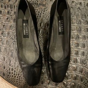 Used Stuart Weitzman black patent pumps. Size 8